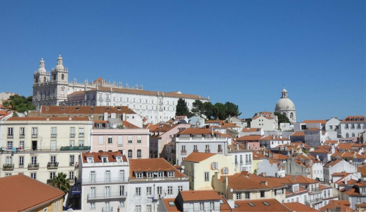 Rooftops of Lisbon with São Vicente de Fora Monastery and the National Pantheon in the background
