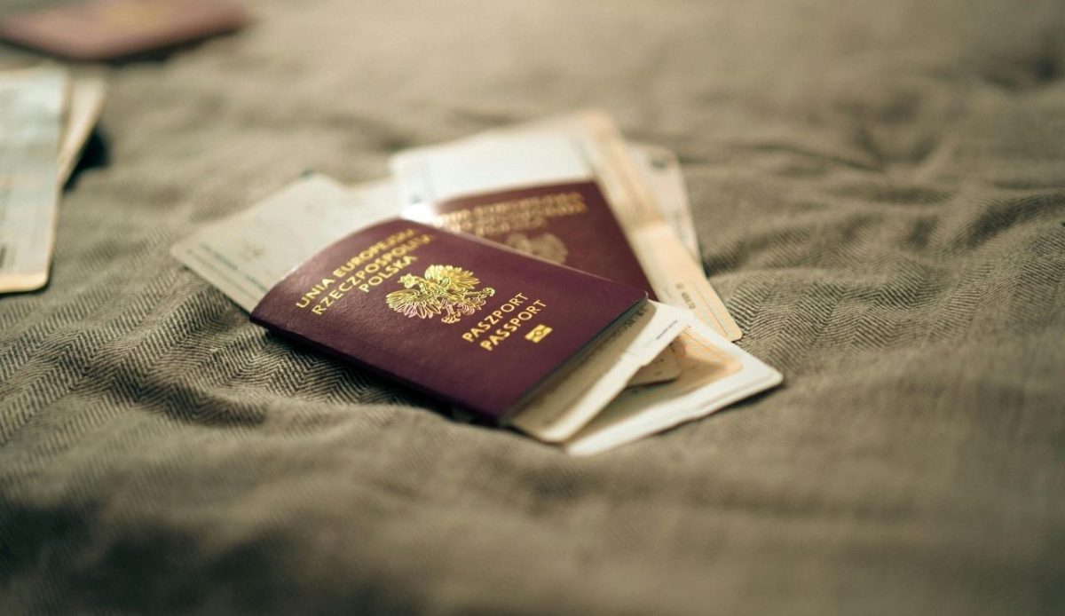 Polish passports with boarding passes placed on a fabric surface
