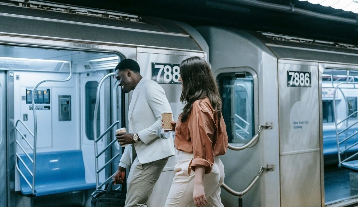 Man and woman boarding subway