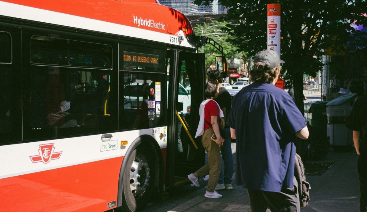 People departure from hybrid electric city bus