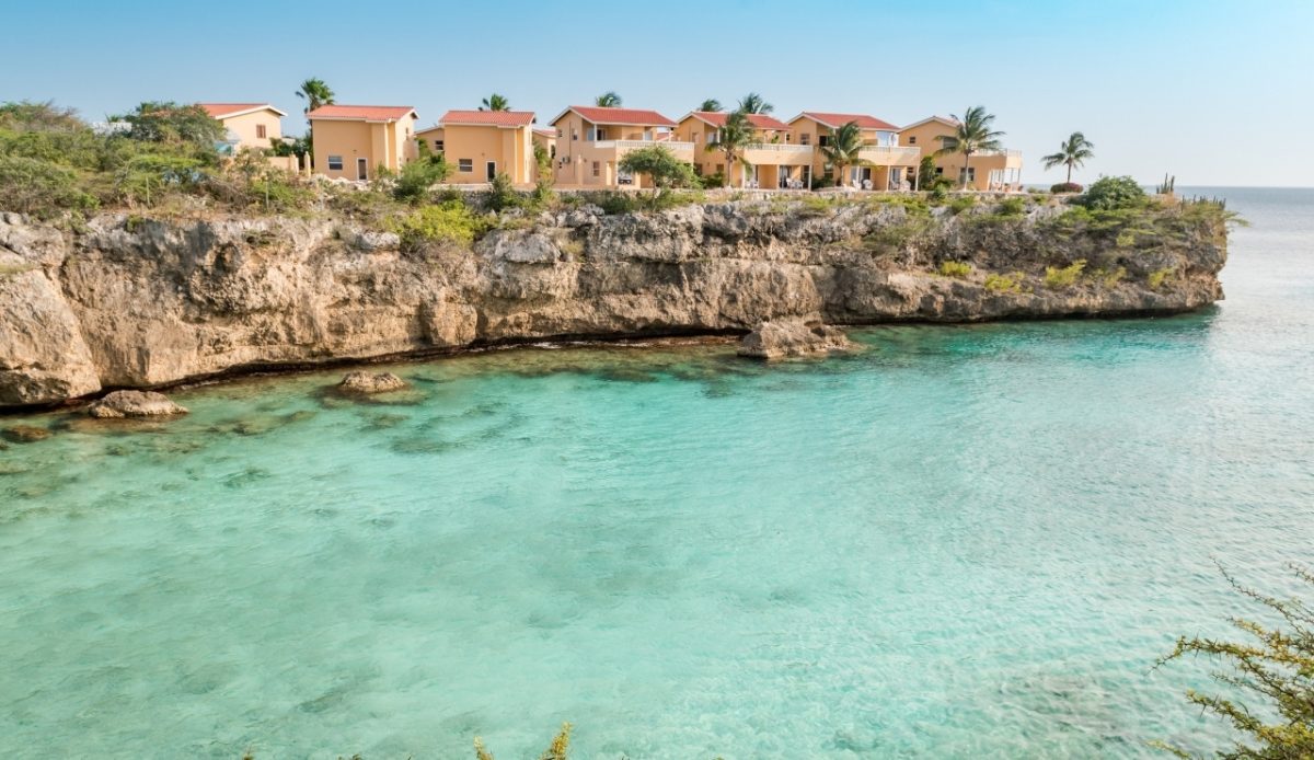 14 Top Snorkeling Beaches Around the World for Underwater Adventure 10 Cliffside villas overlooking the clear turquoise water at Playa Lagun, Curacao