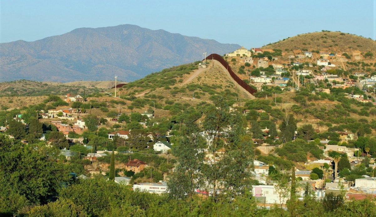 10 Arizona Cities Retirees Often Avoid Living In 8 Nogales, Arizona View of residential areas and the border fence with Mexico