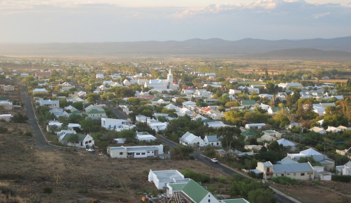 15 Small Towns in South Africa Travelers Should Visit Now 9 Aerial view of the town of Prince Albert, Western Cape, South Africa, with surrounding mountains