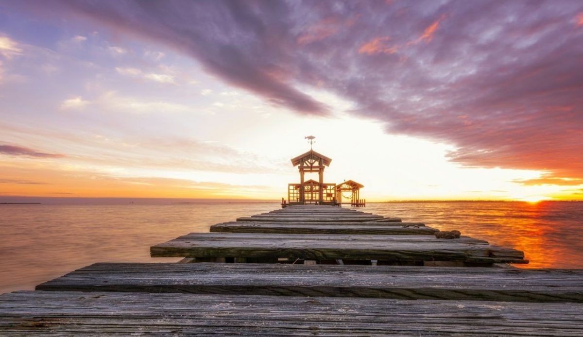 Sunset overlooking a dock in Ocean Springs, MS Ocean Springs Road, Ocean Springs, MS, USA 