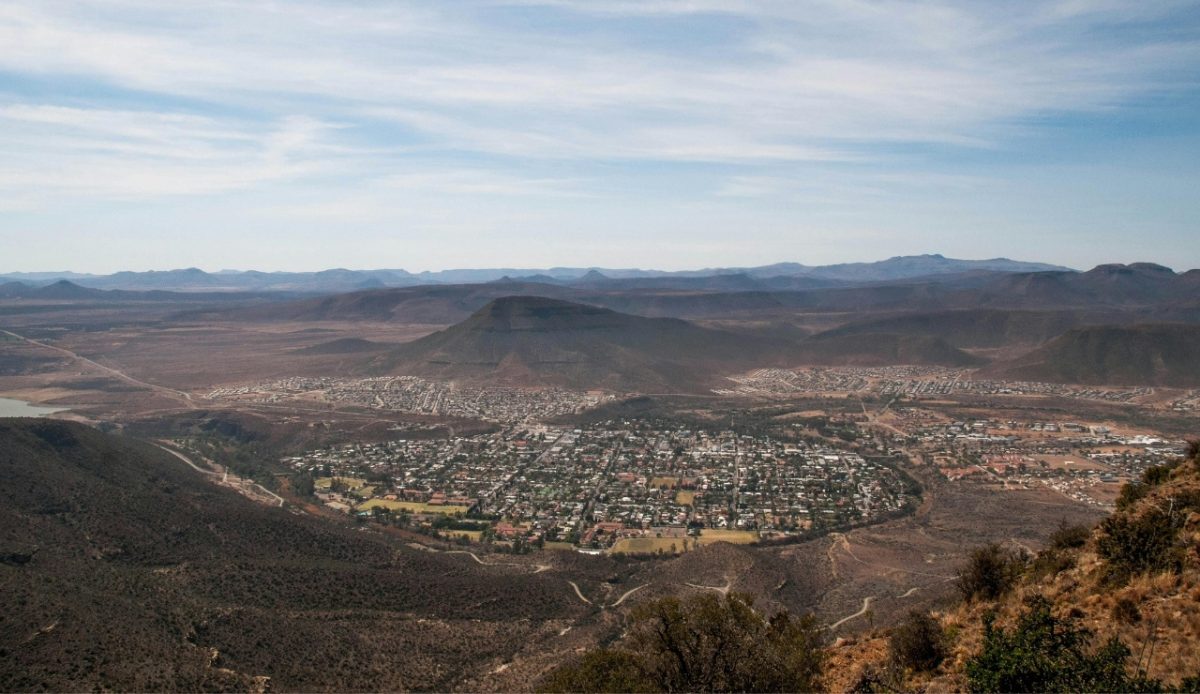 15 Small Towns in South Africa Travelers Should Visit Now 2 Aerial view of Graaff-Reinet, Eastern Cape, South Africa, surrounded by mountains