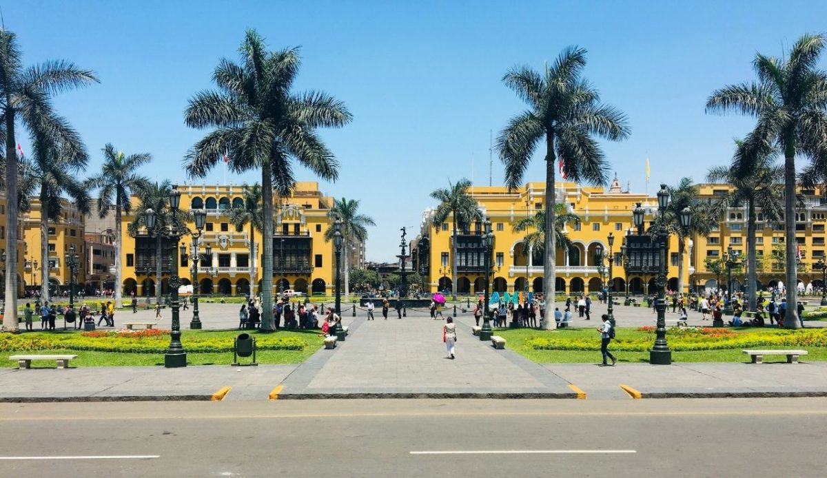 10 Best Food Cities In South America And What To Eat There 1 Plaza Mayor with colonial buildings and palm trees, Lima, Peru