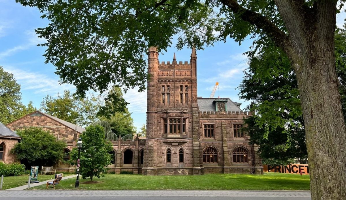 Historic building with a castle-like tower and 'Princeton' sign in front, Princeton, New Jersey Soo