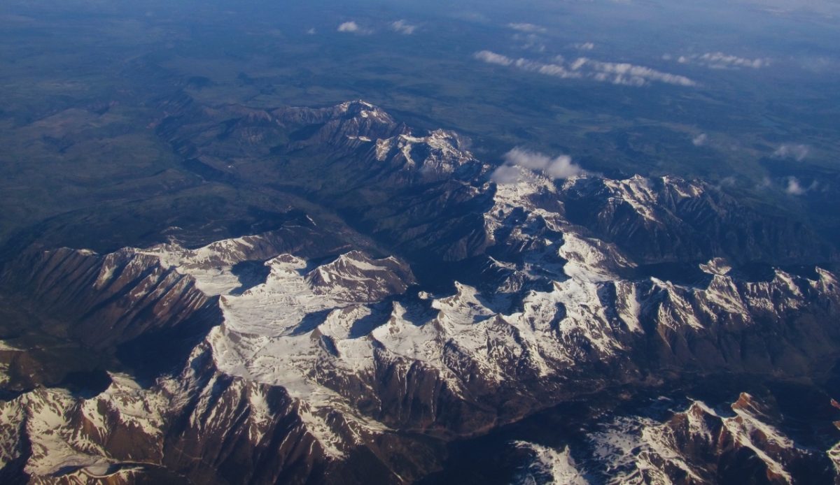 Aerial view of Telluride, Colorado, with snow-covered mountains and valleys 