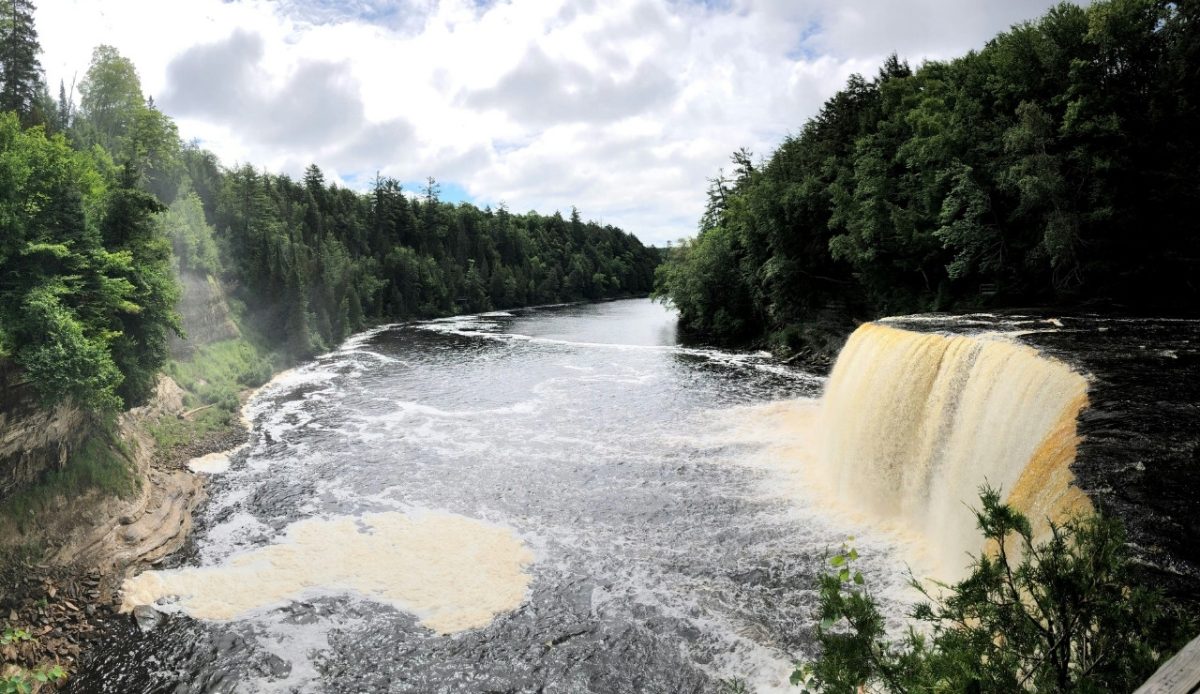 11 Beautiful Waterfalls Across the US Worth Visiting 8 Tahquamenon Falls in Michigan, USA, with surrounding lush greenery