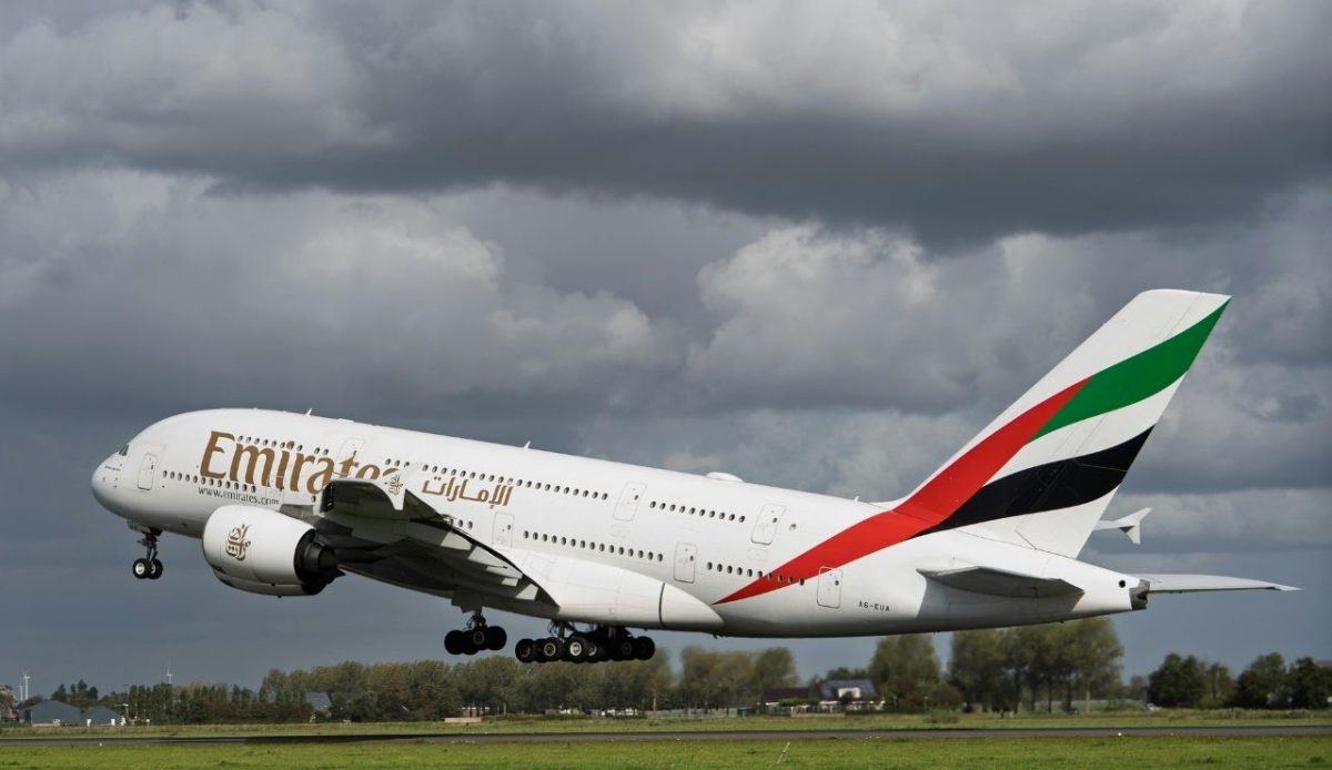 Emirates Airbus A380 taking off under cloudy sky  