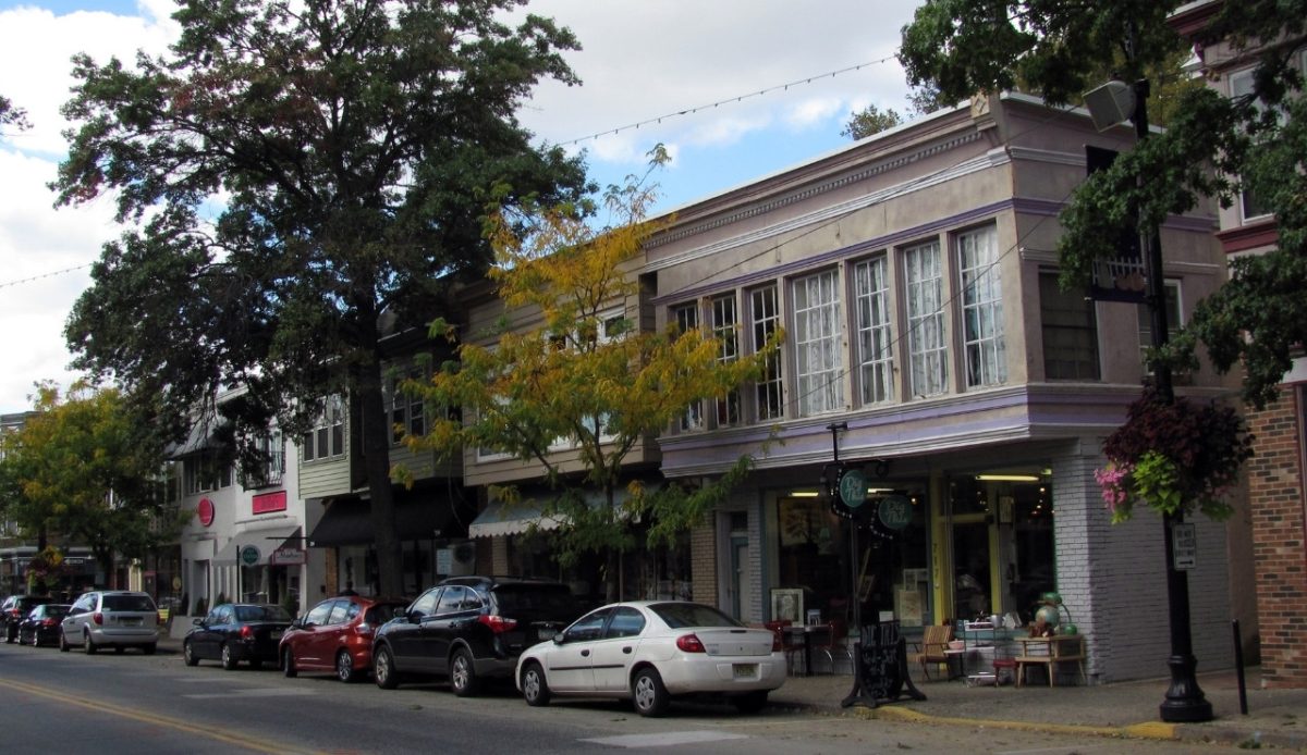 Shops and trees lining a street in the Collingswood Commercial Historic District, New Jersey 