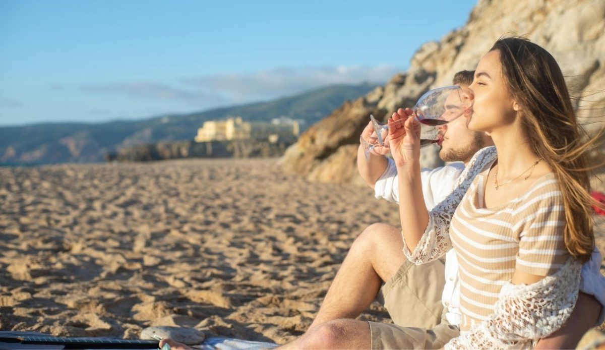 A Couple Drinking Wine at the Shore