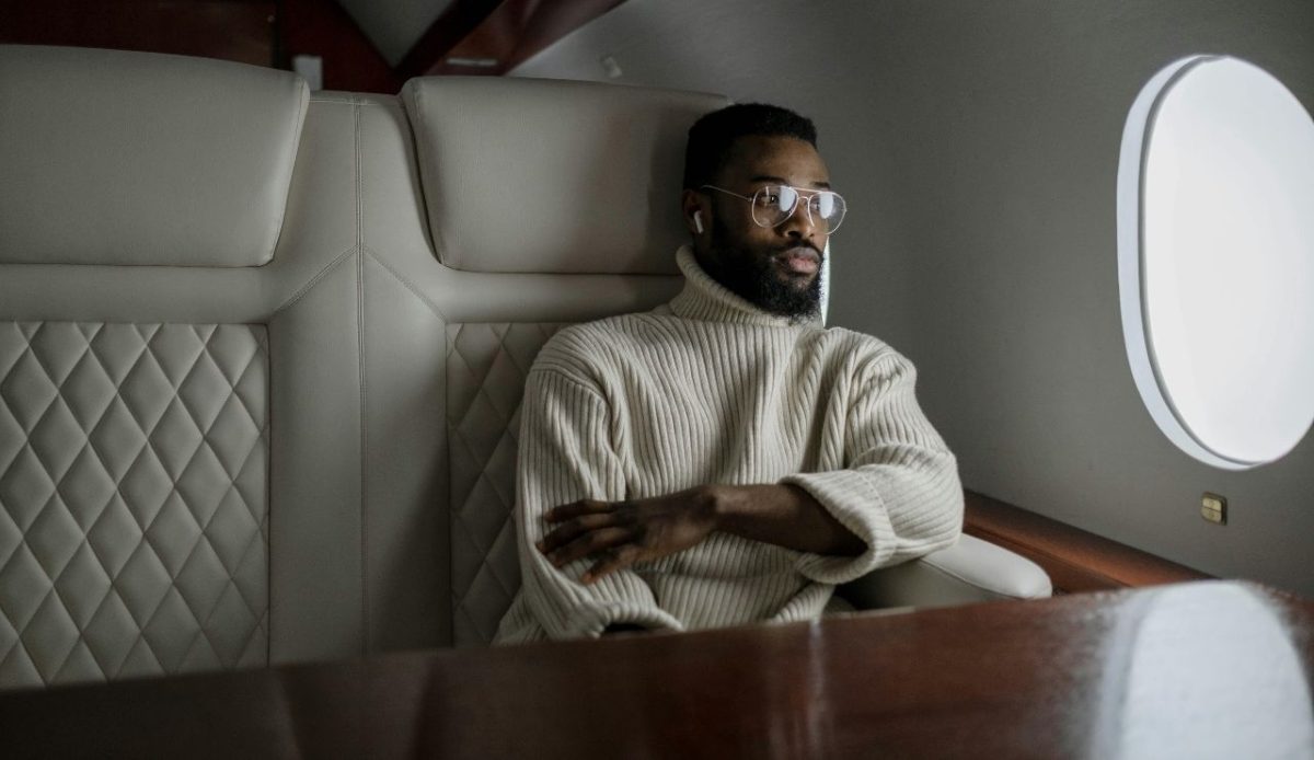 Why More Airlines Are Choosing One Airbus Model for Long-Haul Flights 4 A Man Sitting comforably in the Airplane