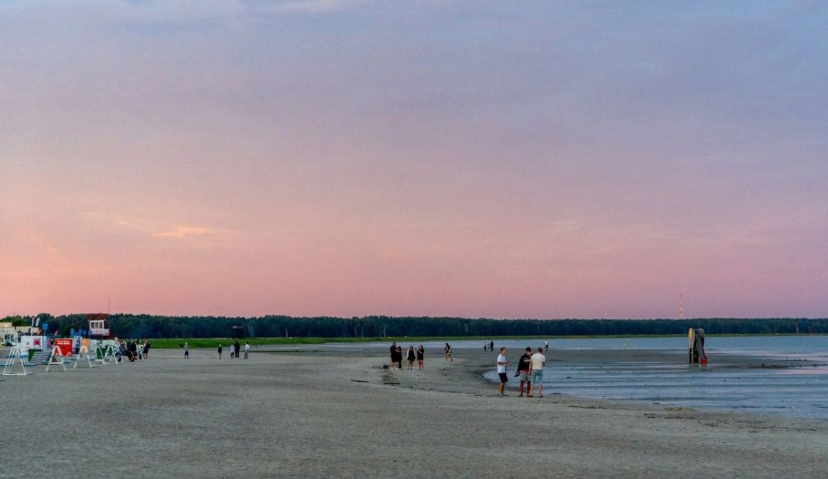 A small number of people wander down just after sunset