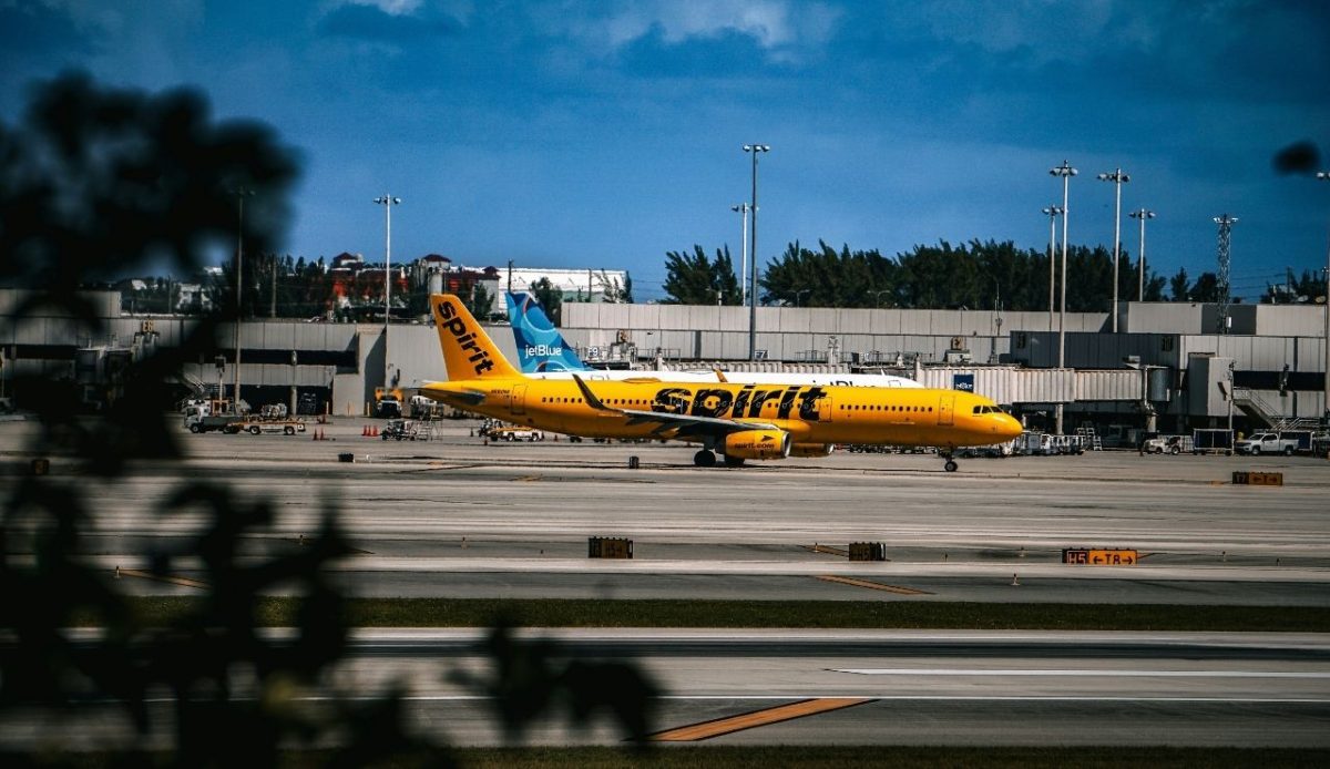 10 US Airlines Ranked From Worst To Best By Travelers 10 A vibrant capture of a Spirit Airlines aircraft ready for takeoff, with a contrasting backdrop of clear skies and an airport terminal. Fort Lauderdale-Hollywood International Airport, Fort Lauderd