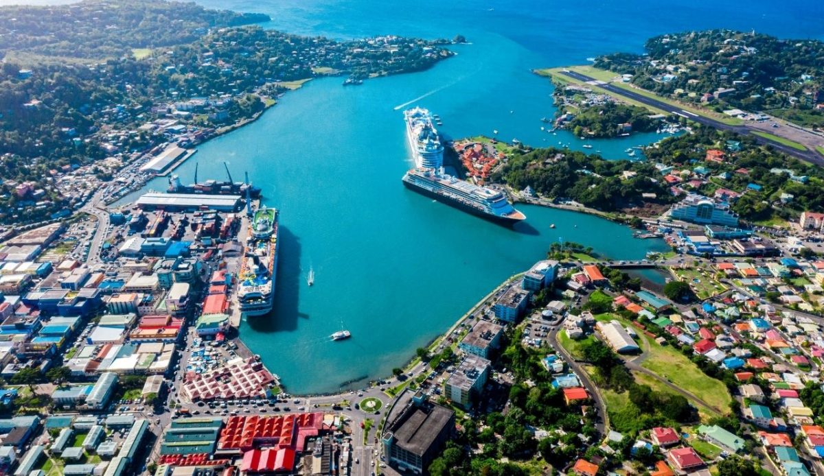 Aerial view of Castries Harbor with cruise ships and George F. L. Charles Airport, Saint Lucia