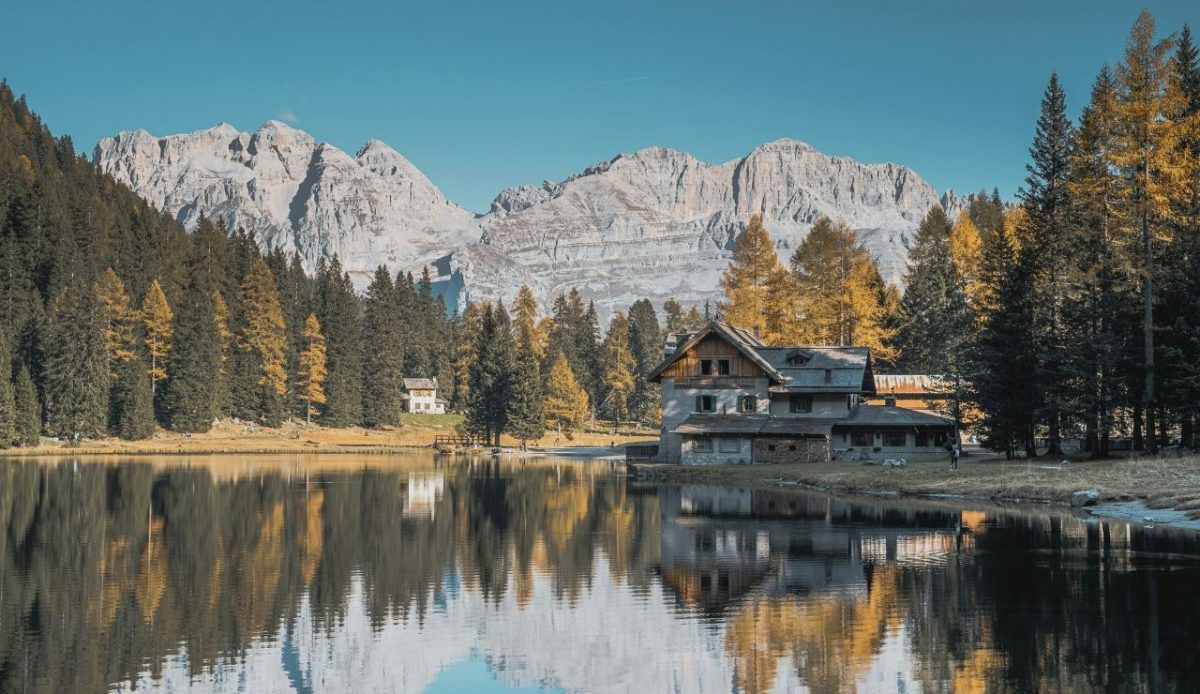 10 Best Ski Resorts in Italy Every Skier Should Visit 3 Autumn reflection at Lake Nambino, Madonna di Campiglio, Italy