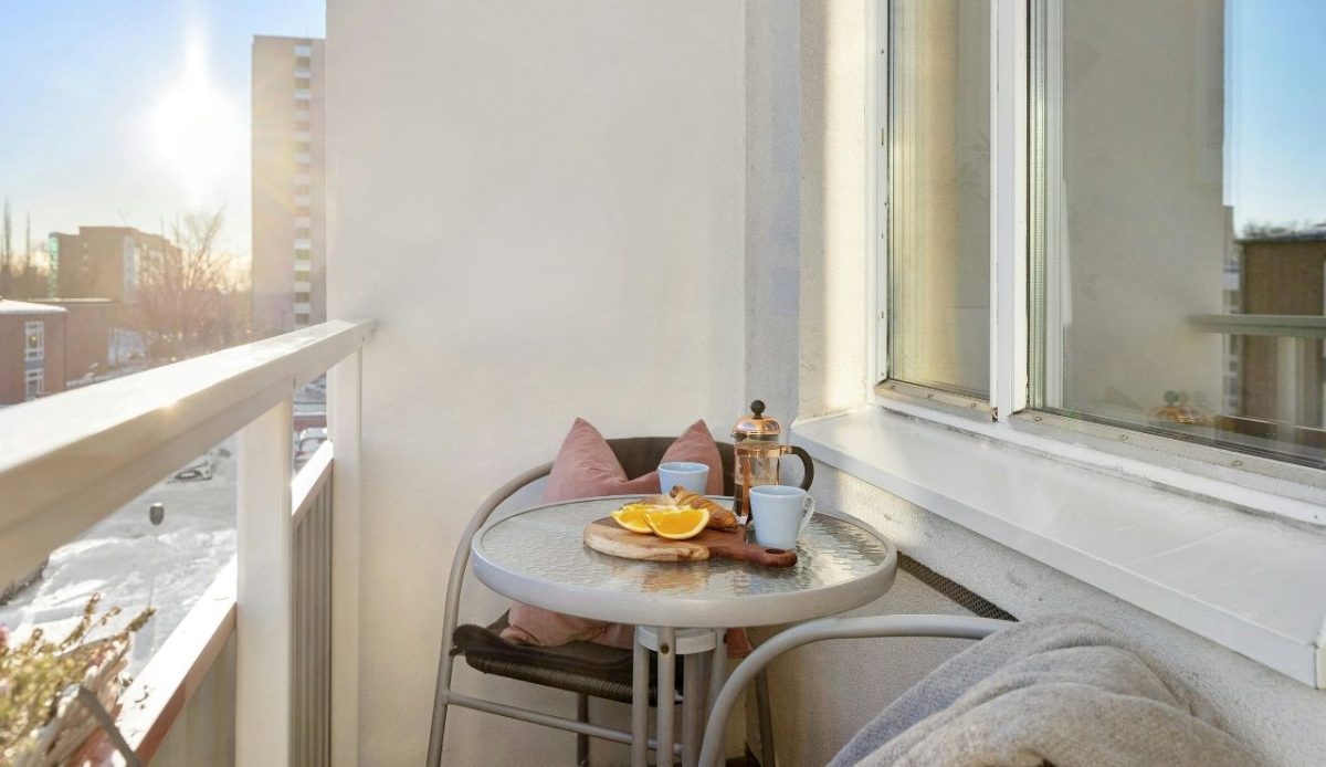 Small Michigan Town Near Ann Arbor Offers Dining, Shopping and Outdoor Fun 5 Balcony with a table and chair and a view of city