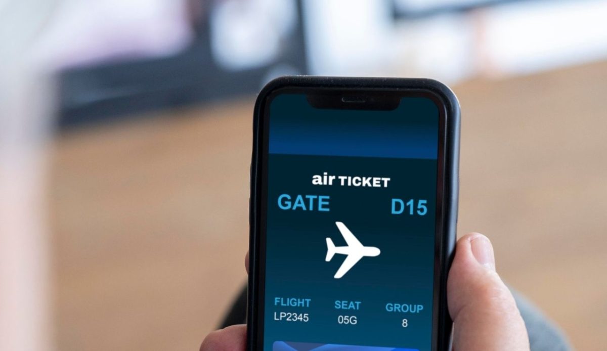 The Unspoken Rules of Airport Lounges and Why They Matter 5 Close up of a person watching airticket on phone