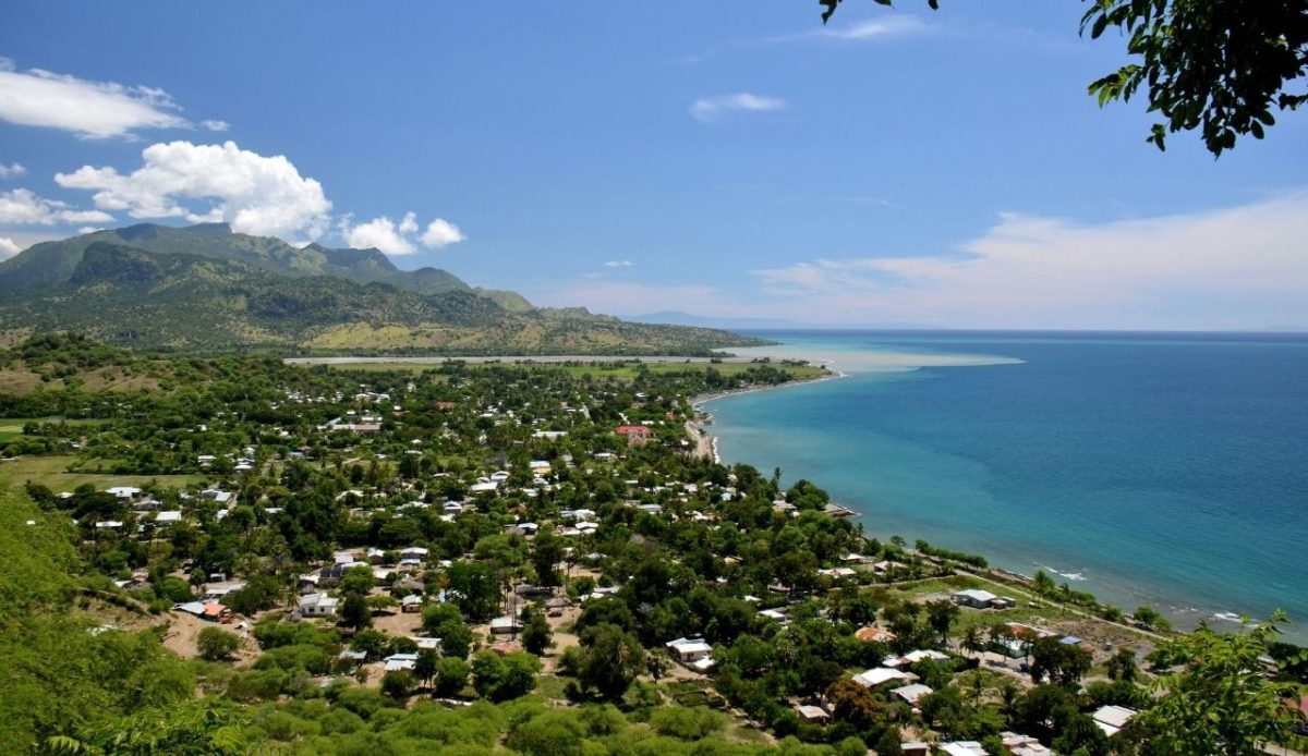 Coastal town of Dili with green hills and blue waters, East Timor 