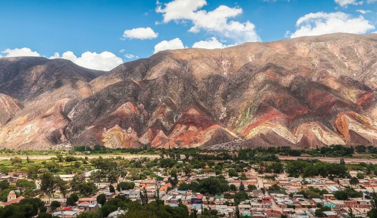 Colorful mountain ridges of Cerro de los Siete Colores rising over Purmamarca, Jujuy, Argentina