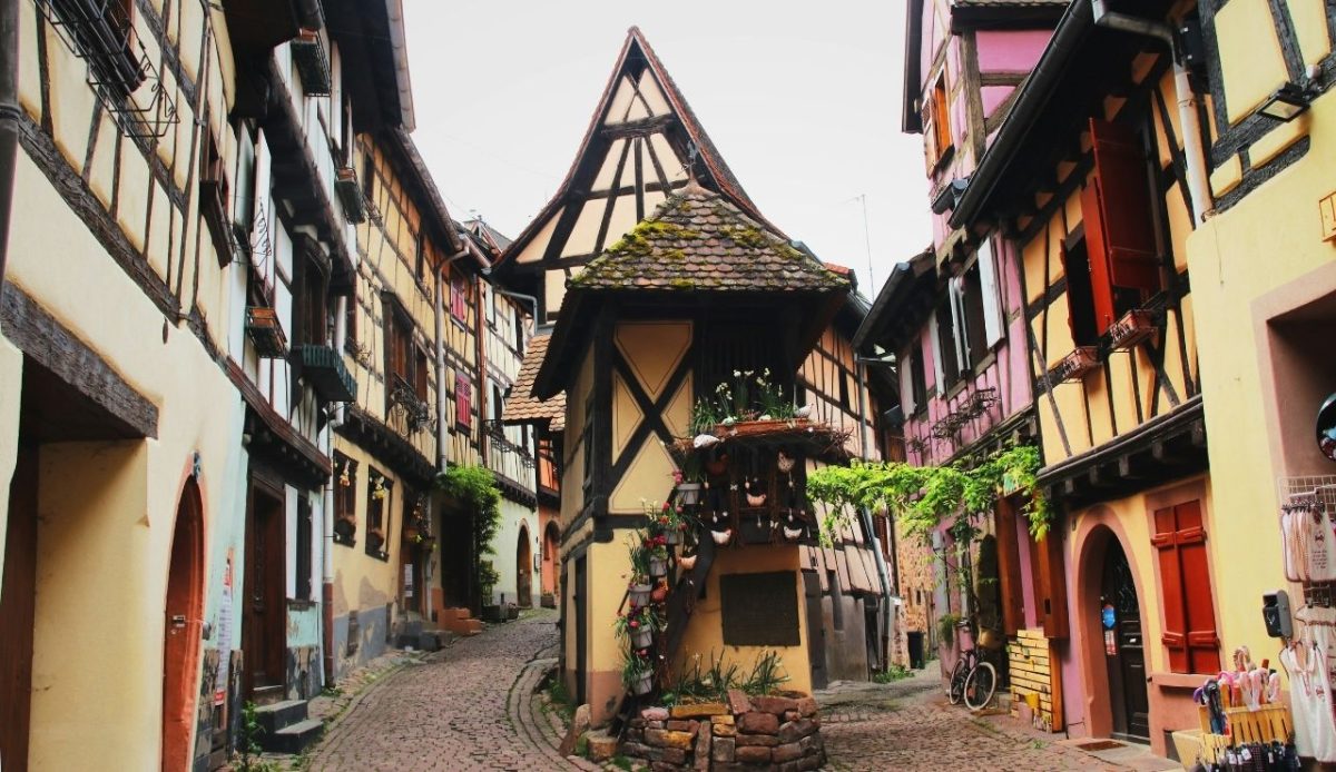 Eguisheim village street with colorful timber homes, Alsace, France      