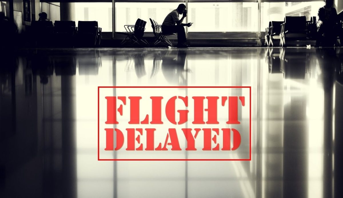 Flight delayed sign at airport