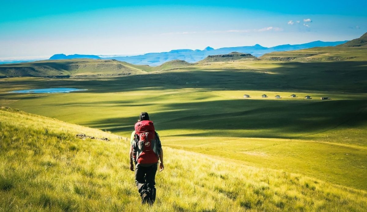 Hiker crossing Drakensberg Mountains, South Africa