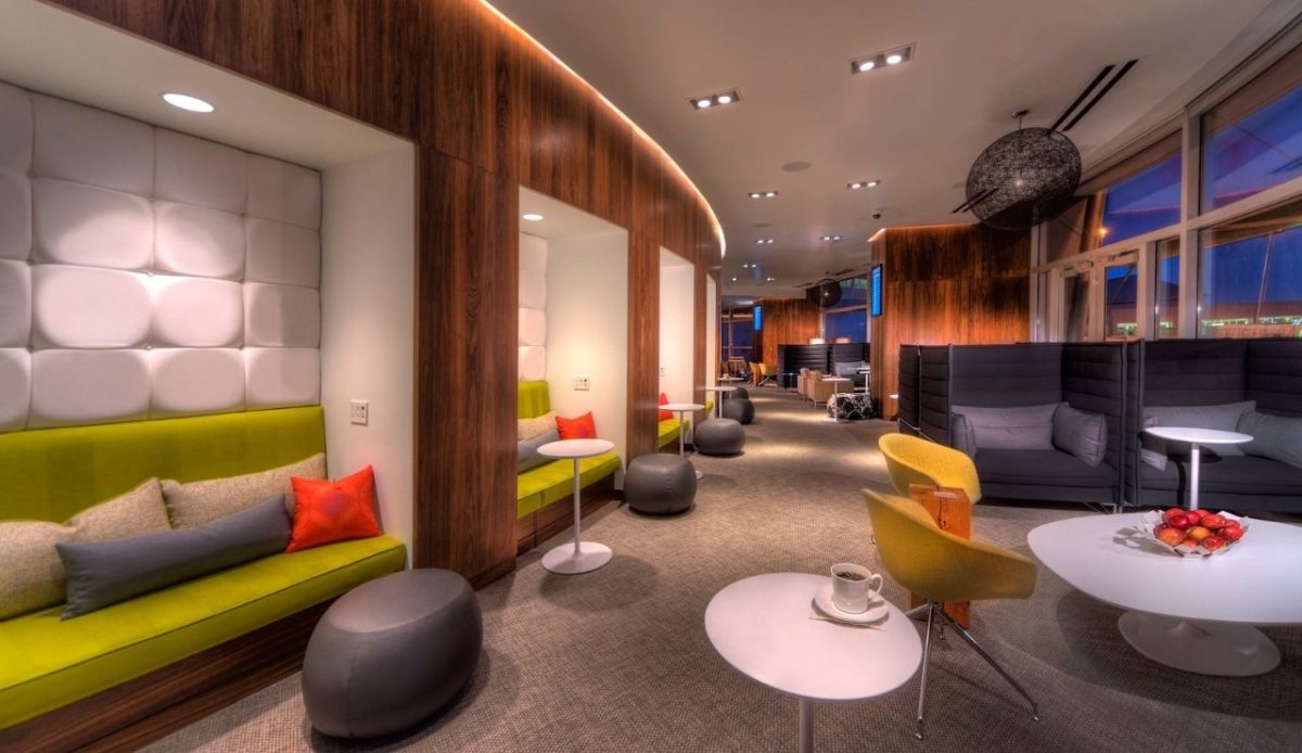 Las vegas Modern airport lounge with cozy seating booths, warm lighting, and contemporary decor       