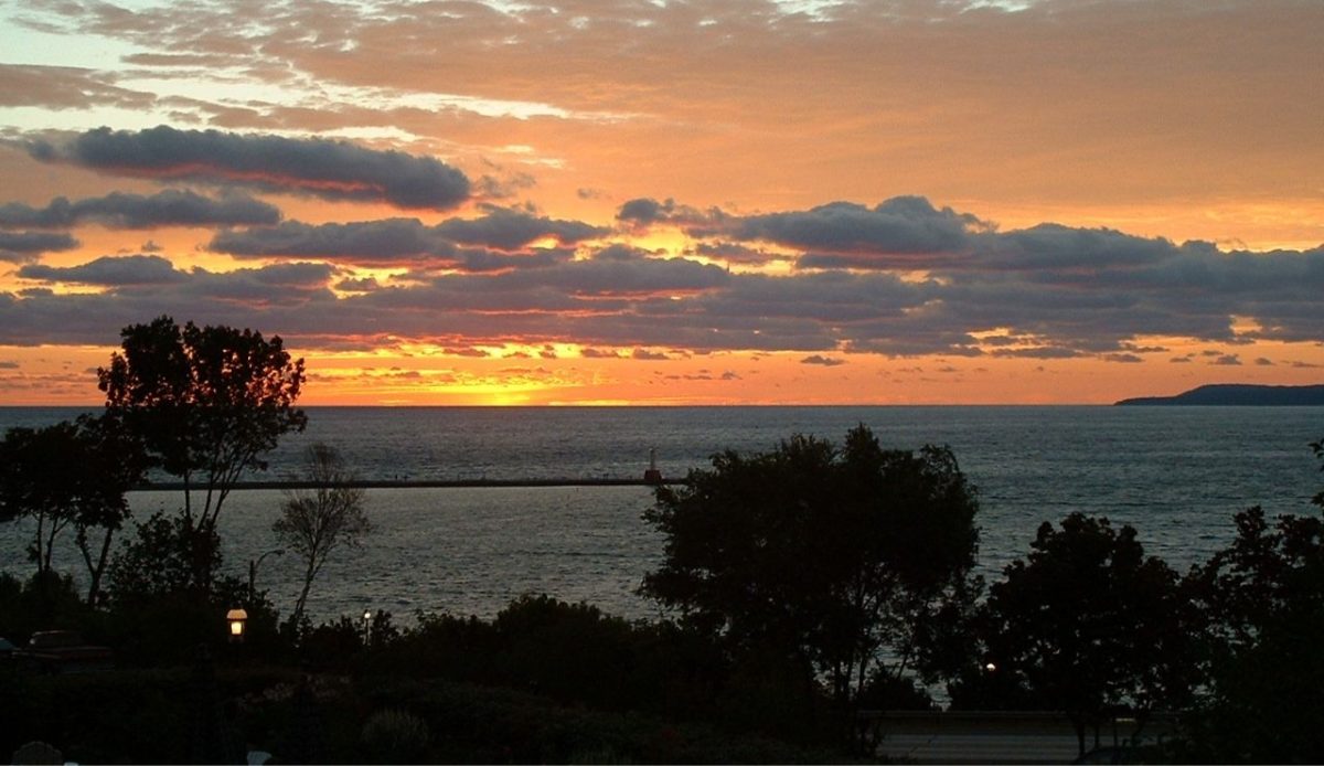 Michigan’s Gold Coast Beaches and Orchards Make the Perfect Road Trip 8 Little Traverse Bay at sunset, viewed from Petoskey, Michigan