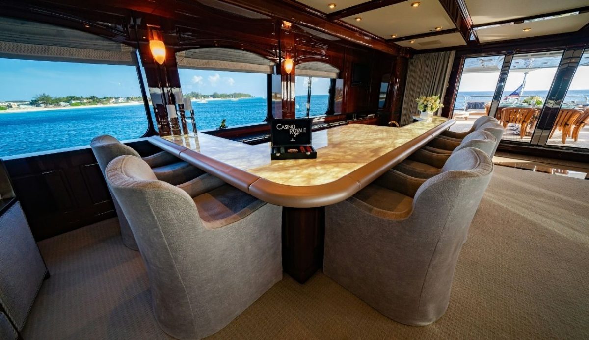 Luxury yacht dining area overlooking turquoise waters