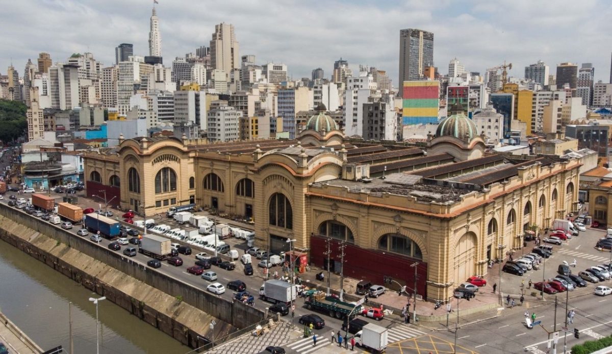 10 Best Food Cities In South America And What To Eat There 2 Mercado Municipal building in São Paulo, Brazil with city skyline