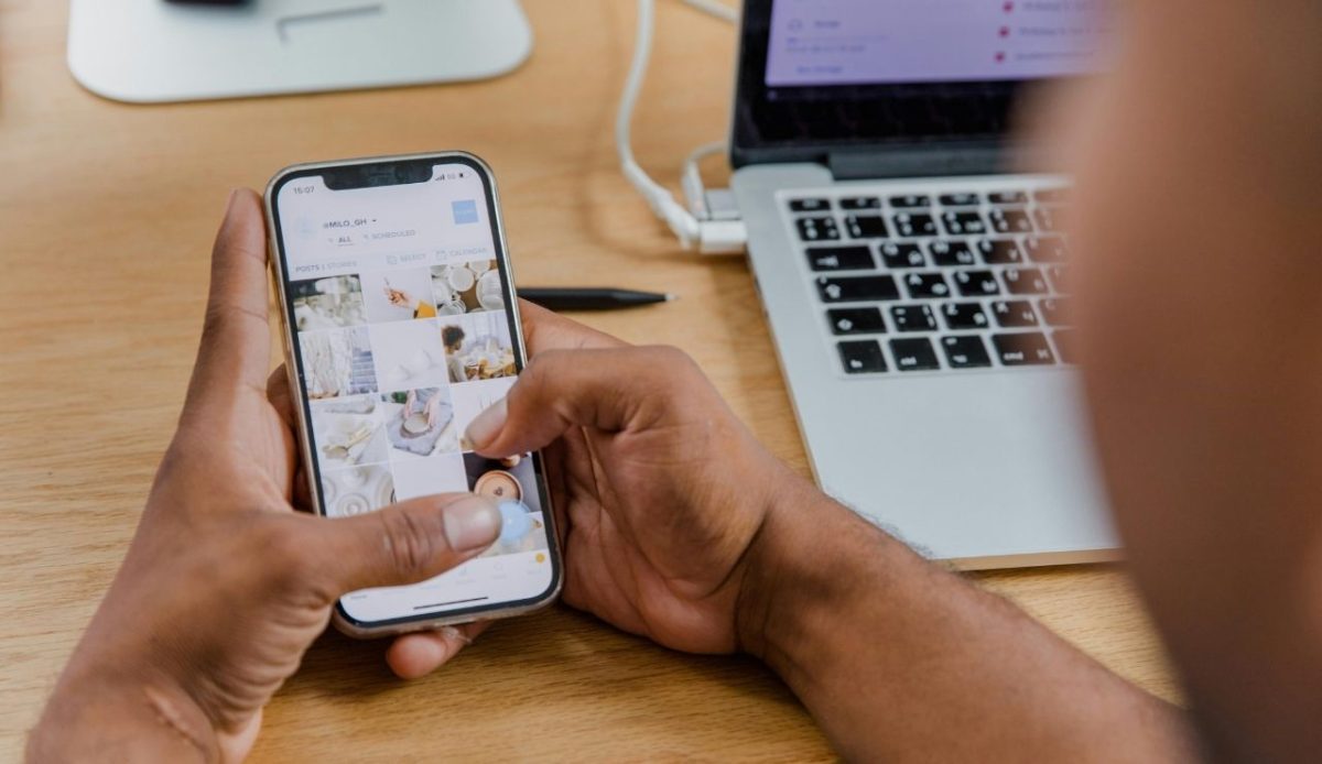 Person checking photos on smartphone