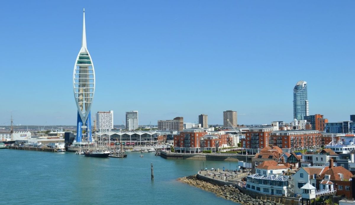 14 Charming Downtowns That Impress Without Skyscrapers 2 Portsmouth harbor with Spinnaker Tower and waterfront buildings