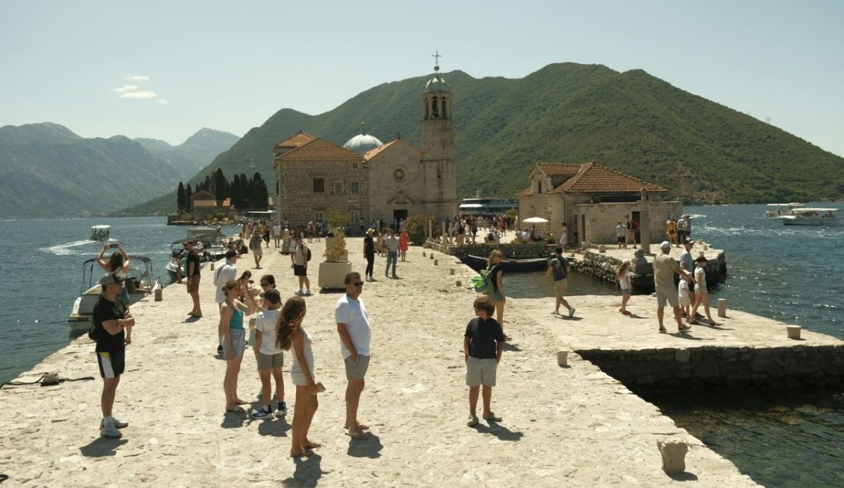 Tourists visiting Our Lady of the Rocks Island in the Bay of Kotor, Montenegro