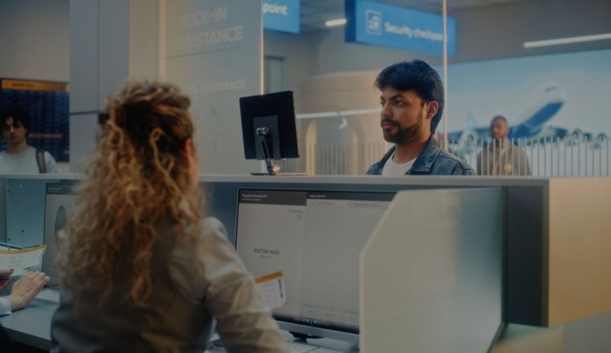 Spain’s New Travel Rules British Travelers Need To Know For 2025 1 Traveler checking in at airport immigration counter, Europe