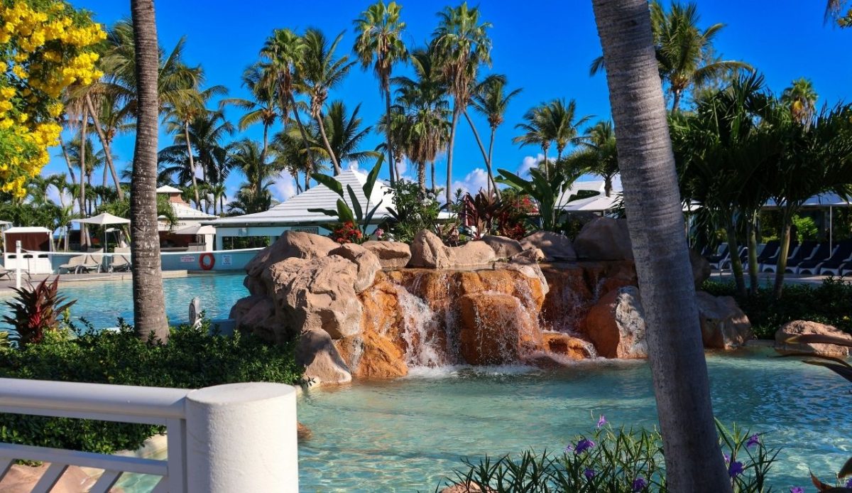 Tropical resort pool with waterfall at Atlantis Paradise Island, Bahamas