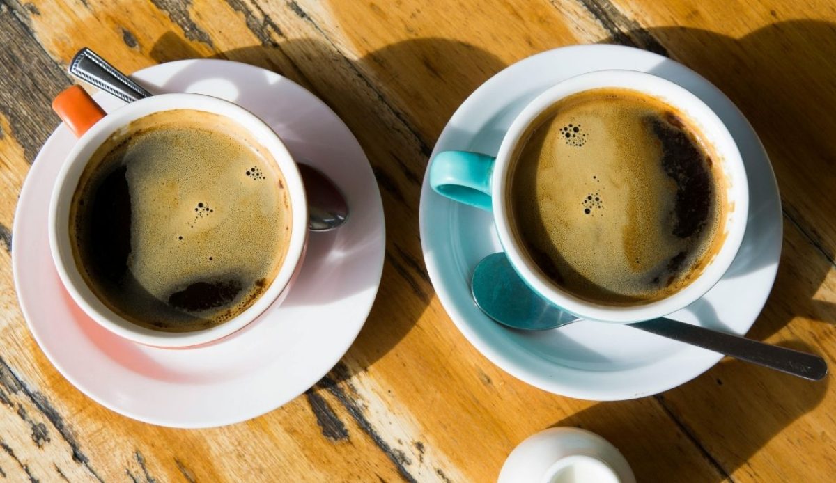 14 Best Airbnb Experiences Around the World Worth Trying 12 Two cups of black coffee on a wooden café table in Melbourne, Australia