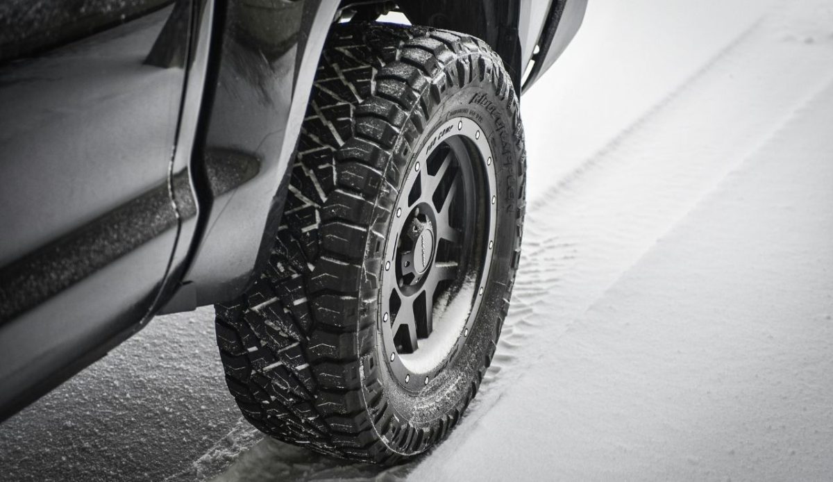 Winter tire on truck driving through snow