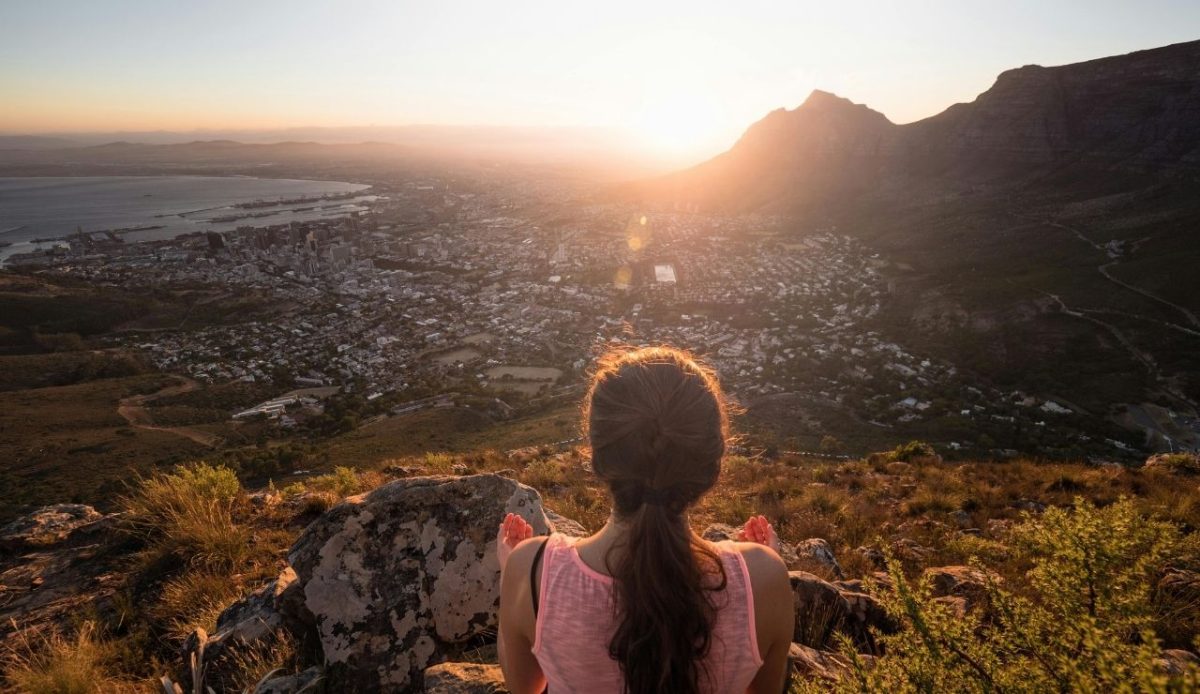 14 Best Airbnb Experiences Around the World Worth Trying 5 Woman watching the sunset over Cape Town from Lion’s Head, South Africa