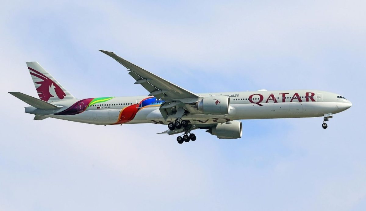 Qatar Airways Boeing 777 in flight with landing gear down