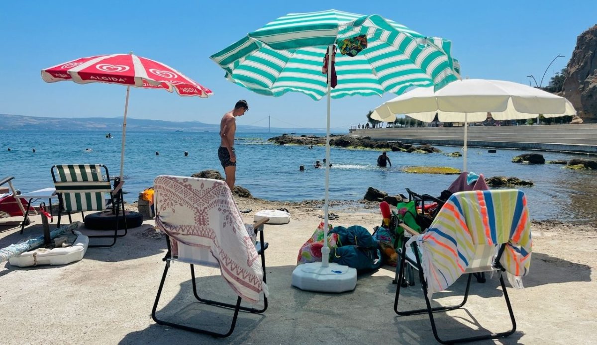colorful beach umbrellas and chairs by the seaside on a sunny day