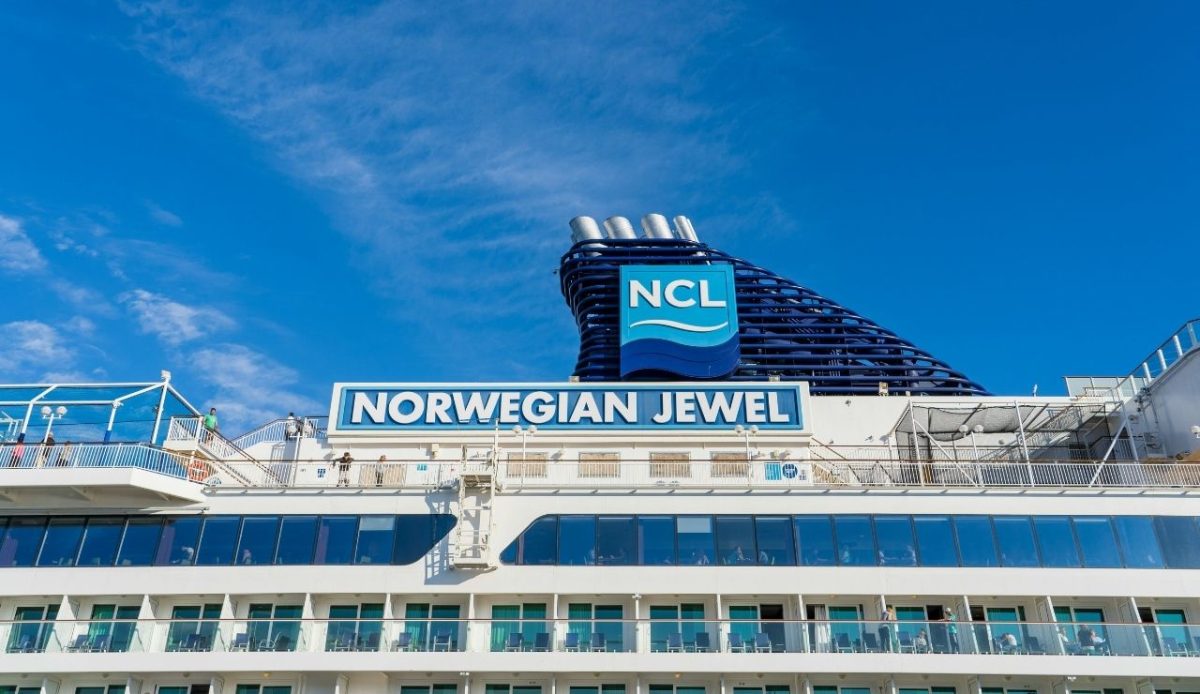 Norwegian Jewel cruise ship exterior with NCL logo under clear blue sky, Miami, Florida, USA
