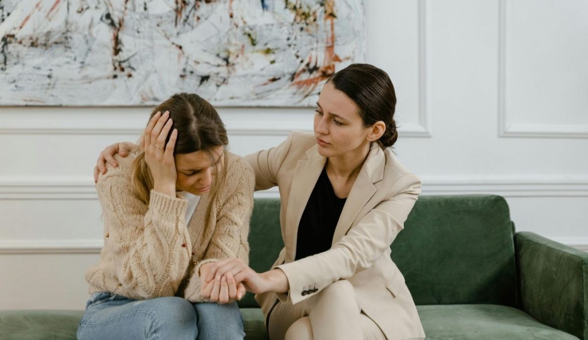 7 Common Phrases Americans Should Skip When Traveling Abroad 1 A woman showing sympathy to other woman