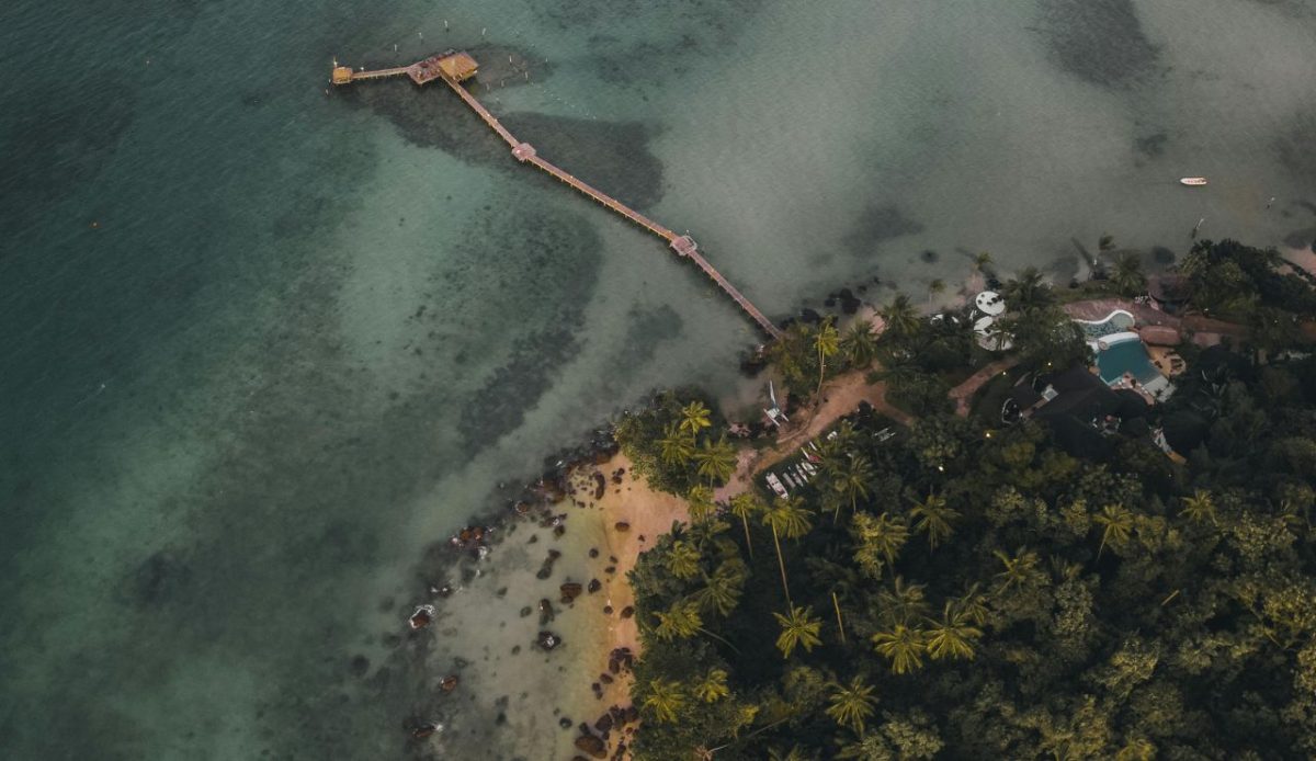 Palm Trees and Pier on Sea Shore .  Ko Mak, จ.ตราด, Thailand    