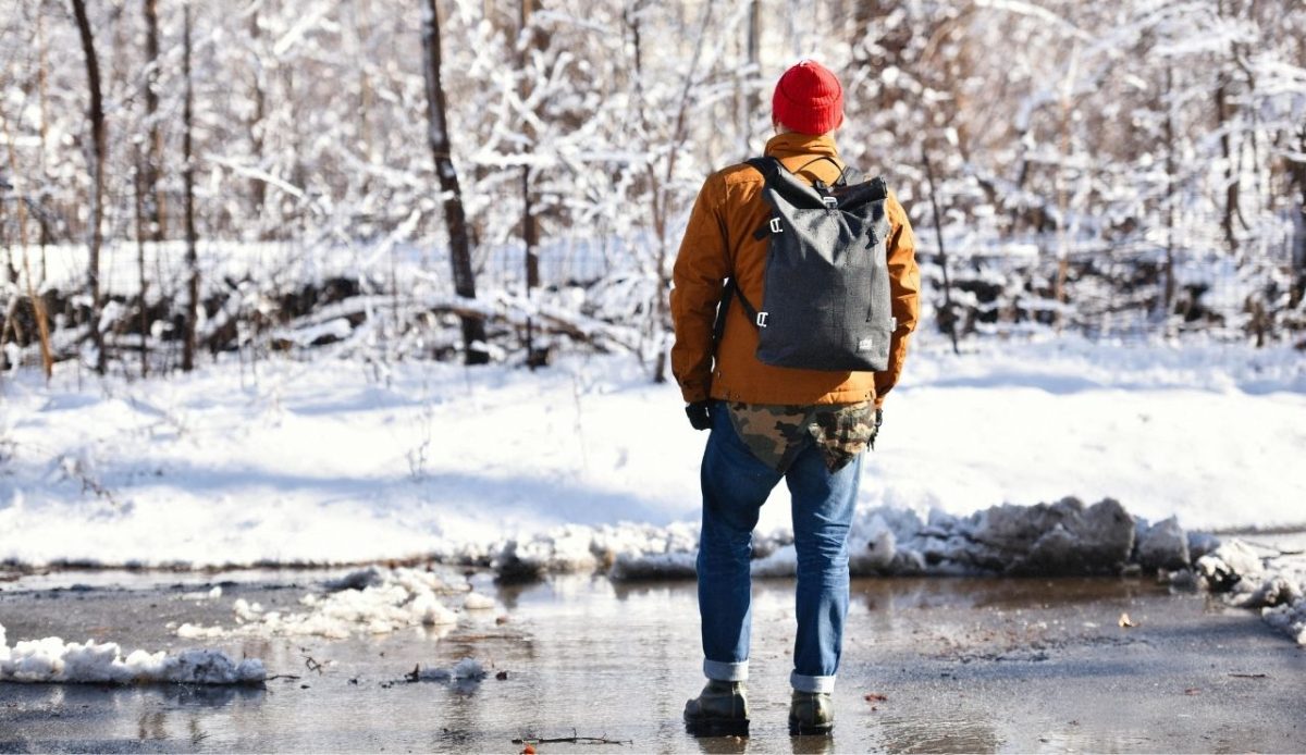 Man Standing near Trees in Snow           