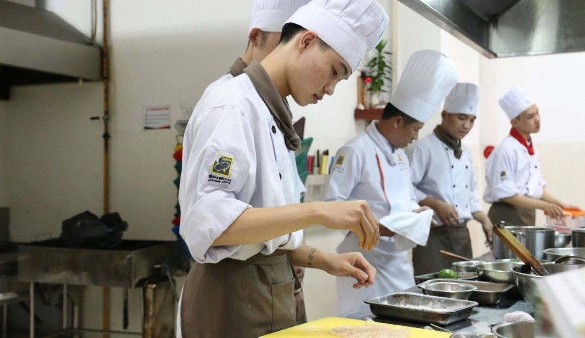 Teens learning to cook local food         