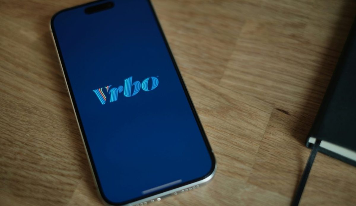 A cellphone displaying vrbo app on screen      