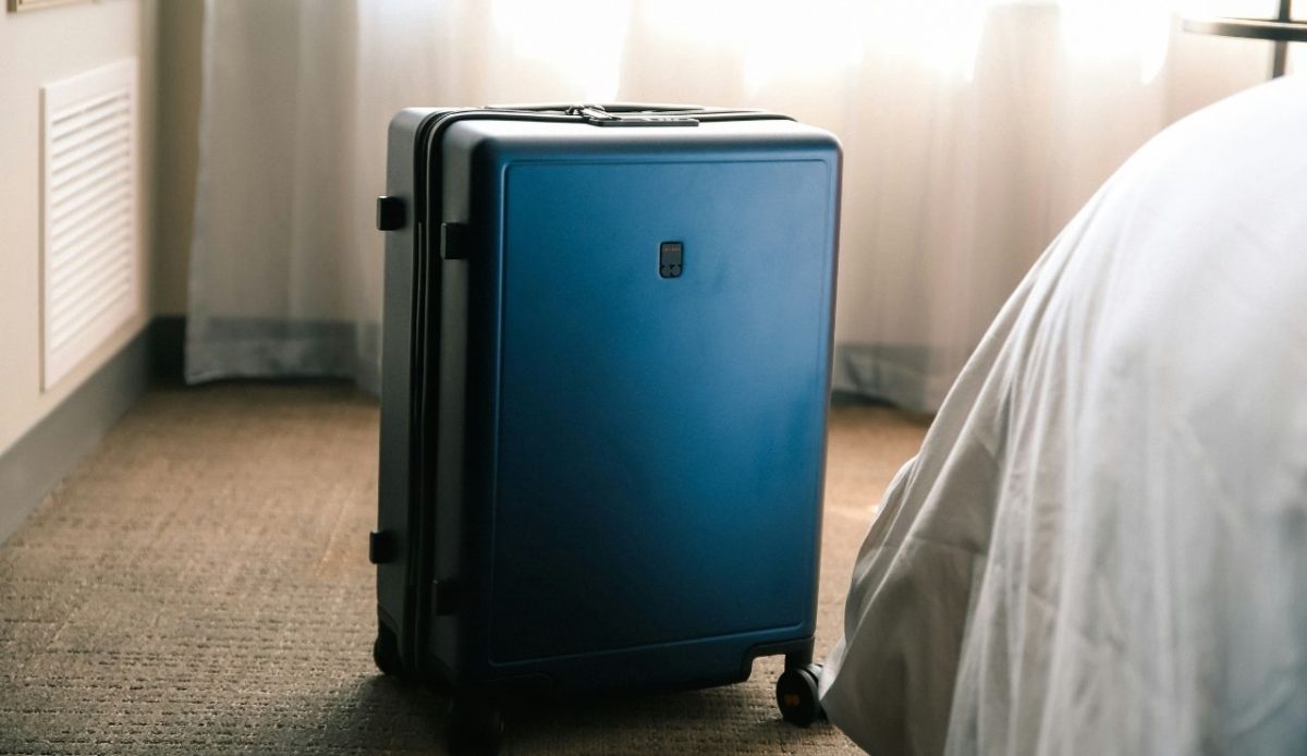 A suitcase placed in hotel room      