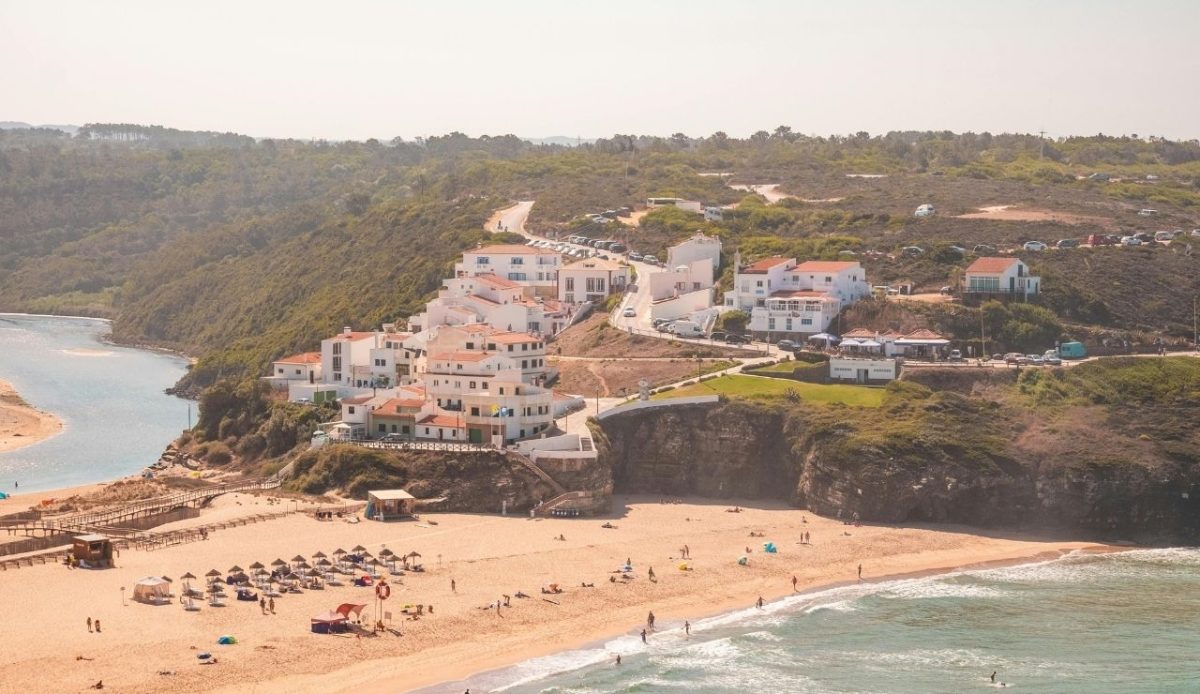 Aerial Panorama of a Picturesque Hill Village at Ocean Shore, Odeceixe, Portugal         